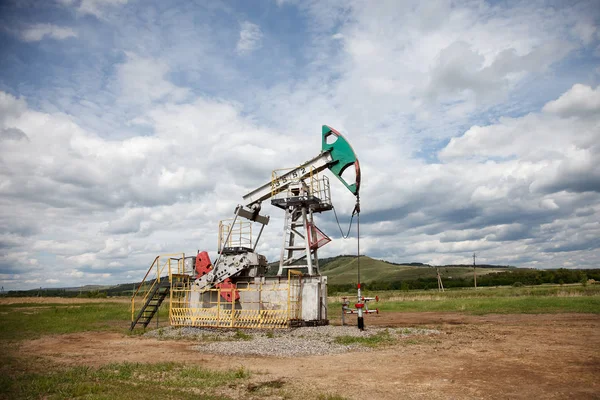 The machine tool for an oil recovery in a summer landscape