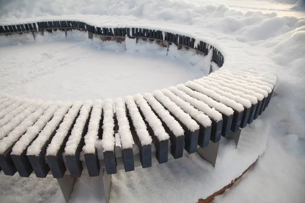 Snow covered bench — Stock Photo, Image