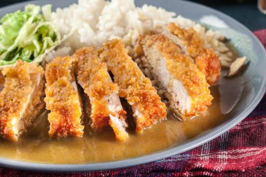 Japanese katsu curry. Deep fried breast chicken cutlet clipart