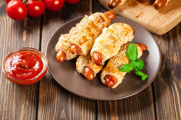 Rolled Hot Dog Sausages Baked Puff Pastry Brown Plate — Stock Photo, Image