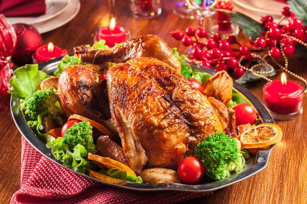 Baked or roasted whole chicken on Christmas table — Stock Photo, Image