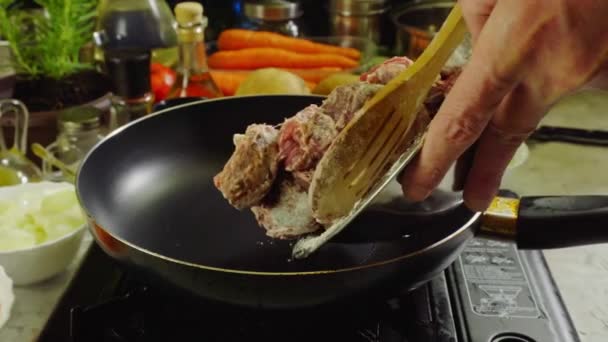 Preparing Irish stew: beef, potatoes, carrots and herbs. Traditional St Patrick's day dish — Stock Footage Preparing Irish Stew Beef Potatoes Carrots Herbs Traditional Patrick Day Royalty Free Stock Video