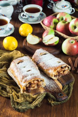 Traditional puff pastry strudel with apple, raisins and cinnamon clipart