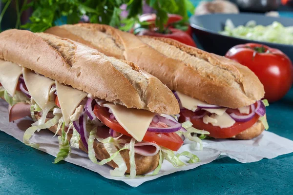 Submarine Sandwiches Ham Cheese Tomatoes Cabbage Cucumber Fresh Delicious Dish — Stock Photo, Image