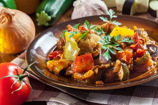 Ratatouille, delicious vegetarian stew. Dish made of zucchini, eggplant, bell peppers, onions, garlic and tomatoes. Traditional french foo