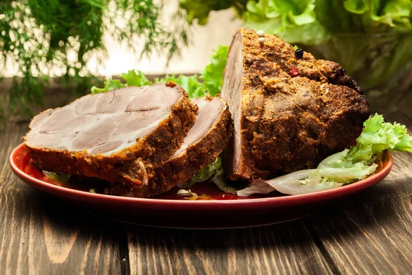 Roasted pork neck with spices on cutting board — Stock Photo, Image