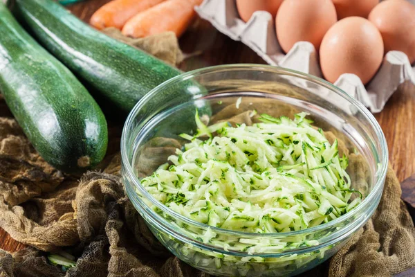 Grated zucchini to prepare fritters — Stock Photo, Image