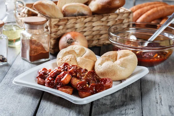 Delicious German currywurst - pieces of sausage with curry sauce — Stock Photo, Image
