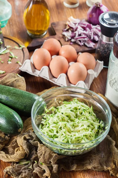 Grated zucchini to prepare fritters — Stock Photo, Image