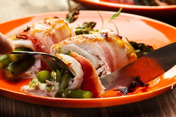Baked fresh asparagus wrapped in chicken and bacon — Stock Photo, Image