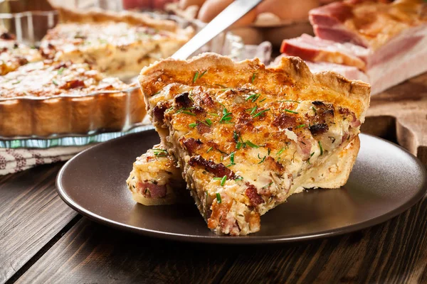 Pieces of quiche lorraine with bacon and cheese — Stock Photo, Image