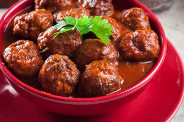 Meatballs with tomato sauce clipart