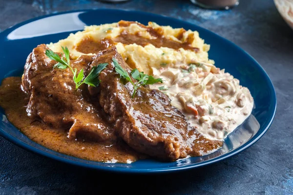 Stewed pork neck with potatoes and sauce — Stock Photo, Image