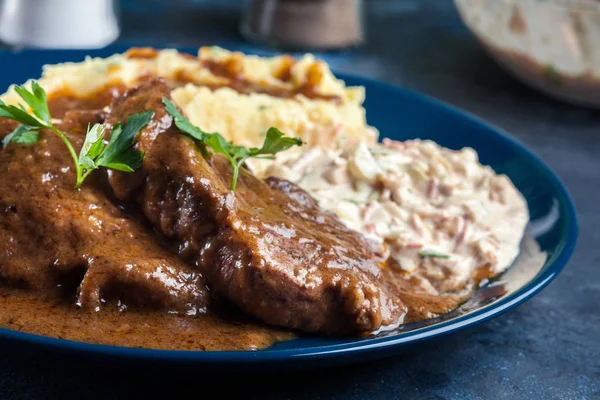 Stewed pork neck with potatoes and sauce — Stock Photo, Image