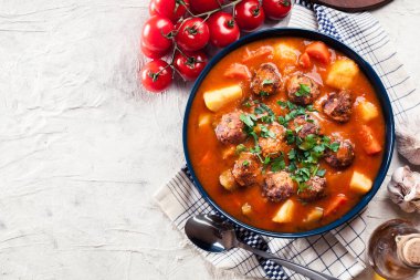 Albondigas - tomato soup with meatballs clipart