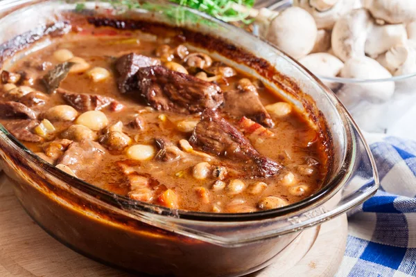 Beef Bourguignon stew in a casserole dish — Stock Photo, Image