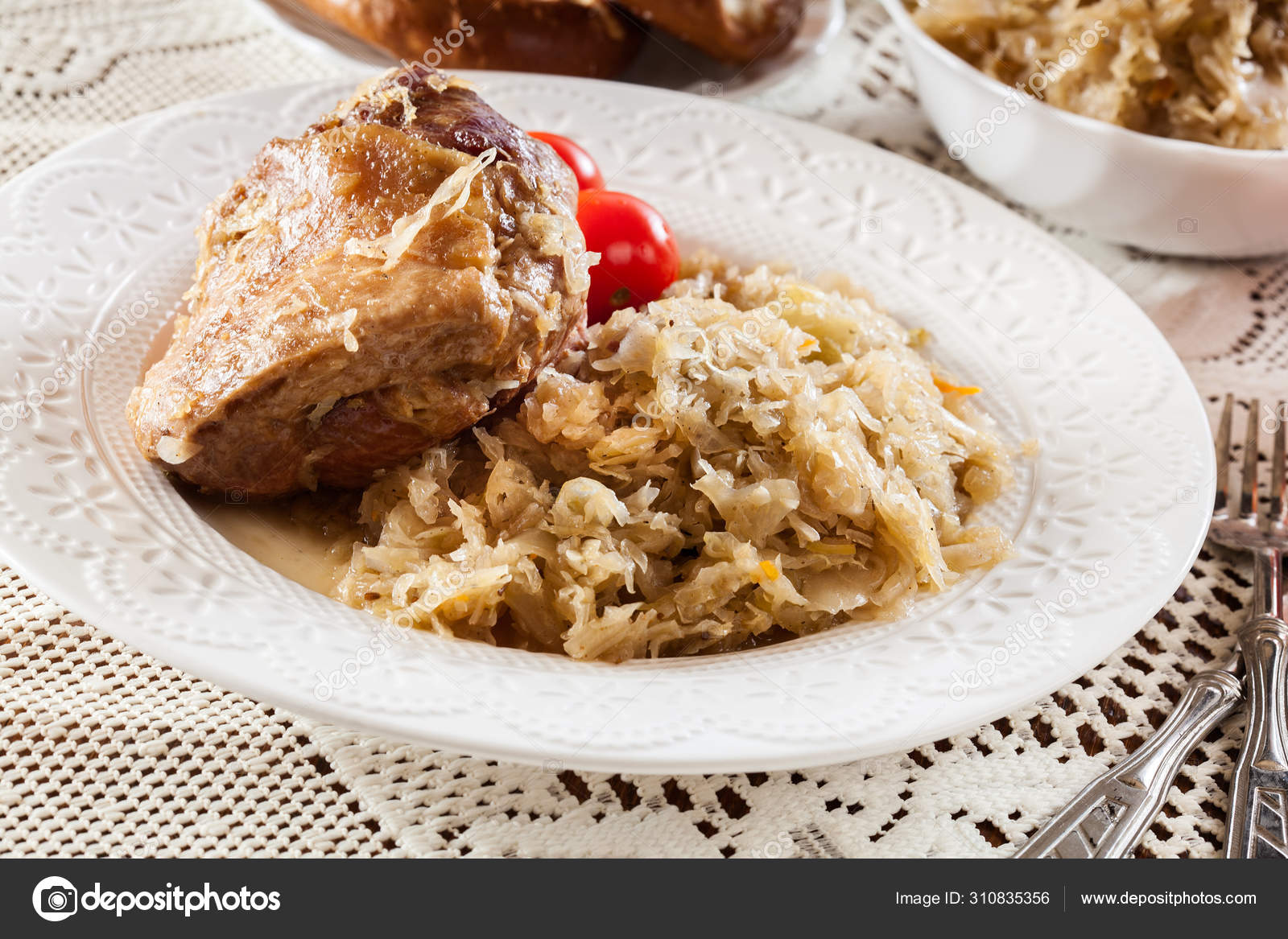 Pork knuckle with fried sauerkraut and tomatoes — Stock Photo © fotek