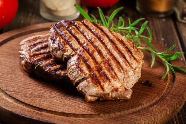 Succulent portions of grilled fillet mignon served with rosemary — Stock Photo, Image