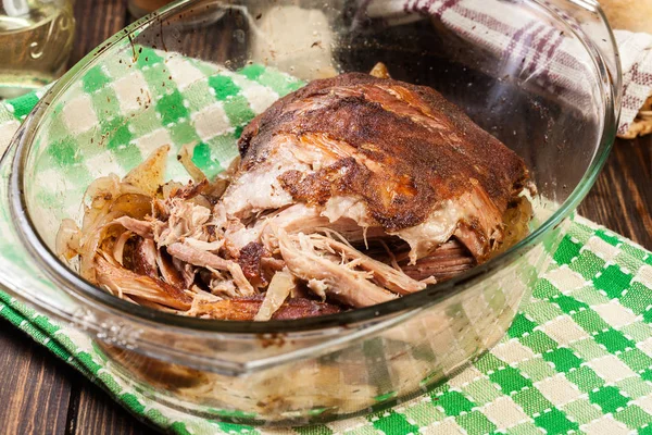 Slow cooked pulled pork shoulder with onion and garlic