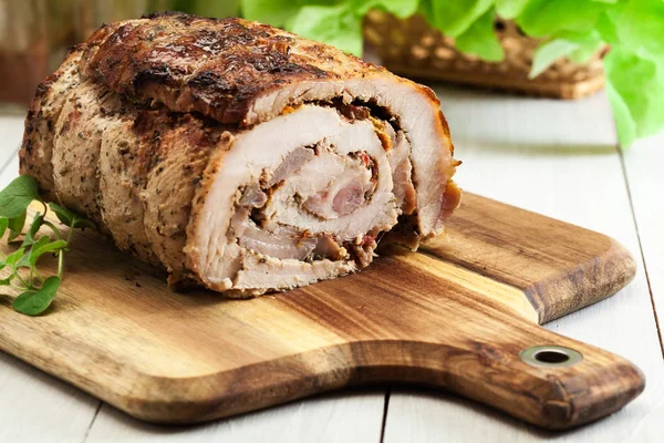 Roasted pork roll stuffed with other meat and dried tomatoes — Stock Photo, Image
