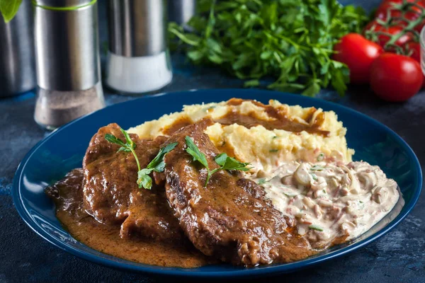 Stewed pork neck in sauce. Served with mashed potatoes and salad — Stock Image Stewed Pork Neck Sauce Served Mashed Potatoes Salad Stock Photo