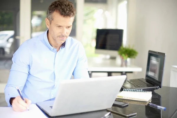 Male Manager Taking Notes While Sitting Office Desk Front Laptop — Stock Photo, Image