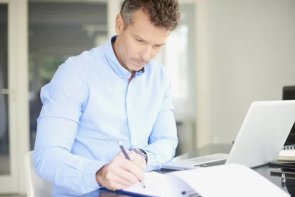 Middle Aged Businessman Working Laptop Writing Something While Sitting Desk — Stock Photo, Image