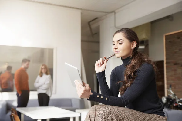 Thinking Young Sales Woman Holding Digital Tablet Her Hand While — Stock Photo, Image