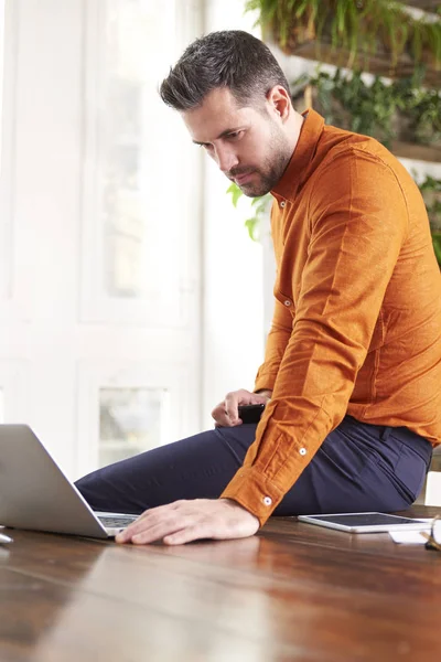 Shot Thinking Businessman Sitting Office Using His Laptop While Working — Stock Photo, Image