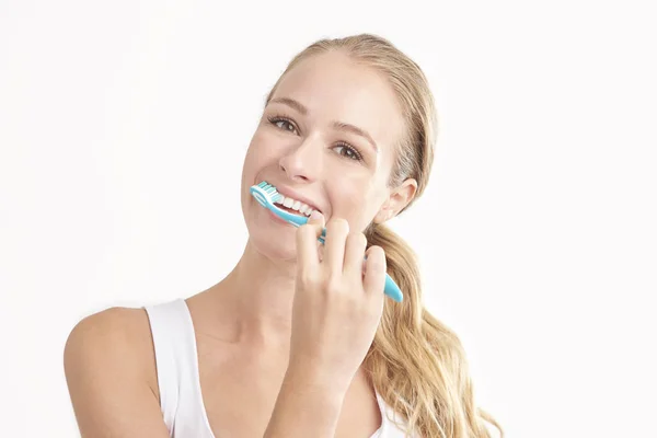 Studio Shot Beautiful Young Woman Brushing Her Teeth While Looking — Stock Photo, Image
