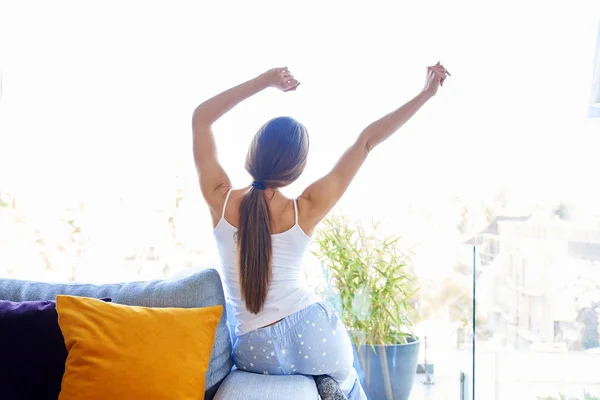 Rear View Shot Young Woman Sitting Couch Stretching Waking Early — Stock Photo, Image