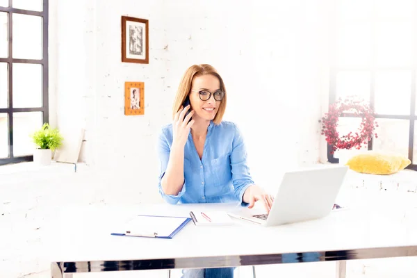 Shot Middle Aged Businesswoman Sitting Her Laptop Making Call While — Stock Photo, Image