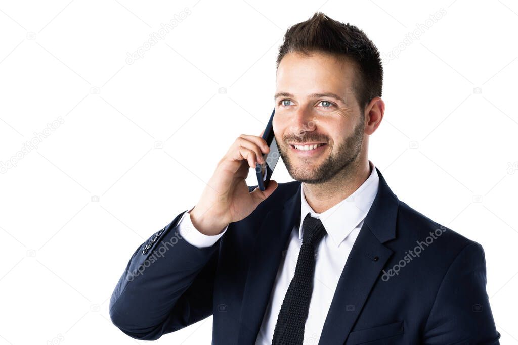 Close-up shot of handsome man wearing suit while standing at isolated white background and using his mobile phone. Copy space. 