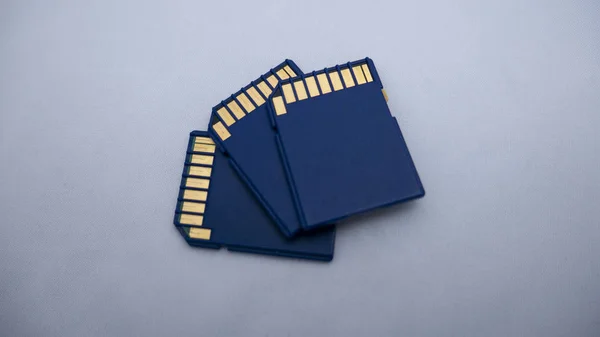 Sdhc memory cards on light background. Tree blue standart memory cards.