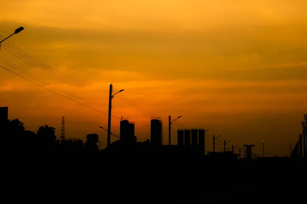 City silhouette with sunset sky.