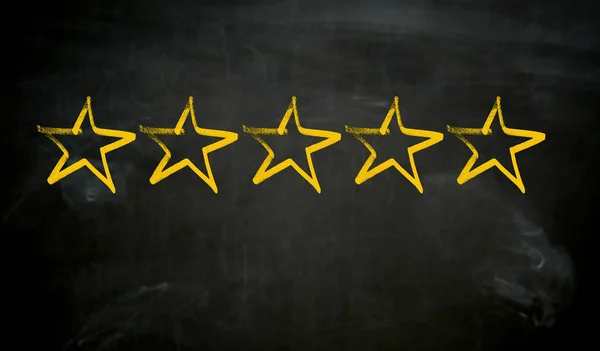 Five stars painted on blackboard concept — Stock Photo, Image