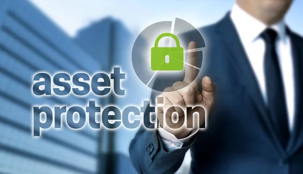 Concepto de protección de activos es demostrado por el hombre de negocios Imagen De Stock
