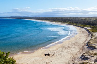BROULEE, AUSTRALIA - SEPTEMBER 18 2025: Views from Broulee lookout over Broulee Beach on a warm sunny spring day in New South Wales, Australia