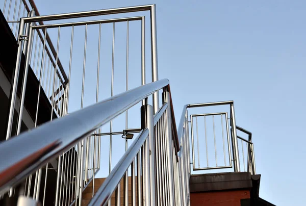 Stainless steel handrails are installed on the steps. — Stock Photo, Image