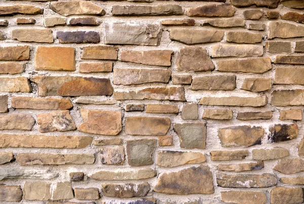 Bronzen muur stenen achtergrond textuur. — Stockfoto