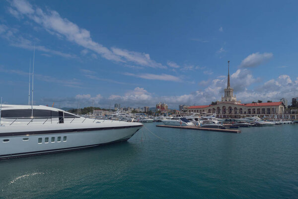 Panarama of luxury yachts docked in sea port at summertime.