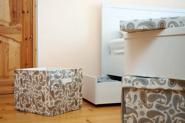 Open card boxes in bedroom — Stock Photo, Image