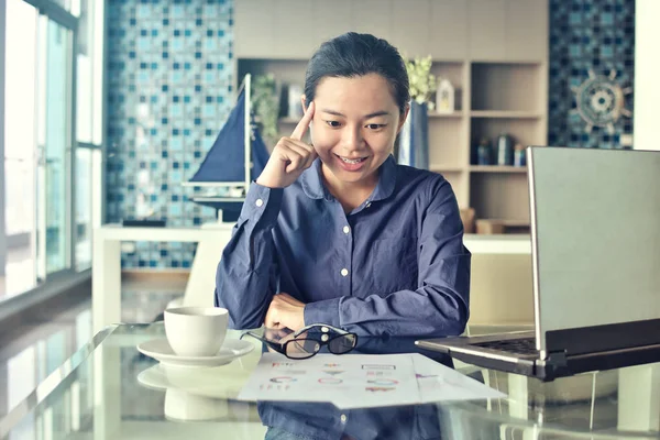 Asian business woman happy got success idea working  indoors office background