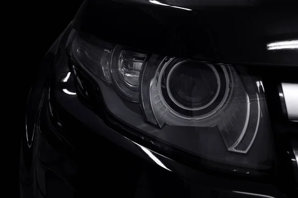 Black car headlights. — Stock Photo, Image