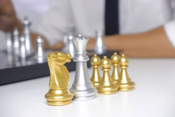 Businessman playing chess game; for business strategy, leadershi