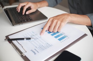 Closeup hand of unrecognizable businessman, accountant, banker at the workplace