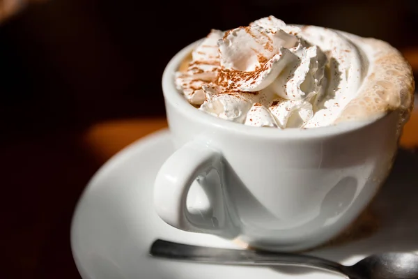 Cup Of Cappuccino With Fresh Whipped Cream And Cinnamon On Top