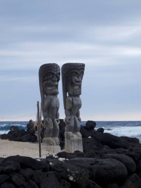 The two ancient wooden Tiki sculptures of the Pu'uhonua o Honaunau National Park, Big Island, Hawaii clipart