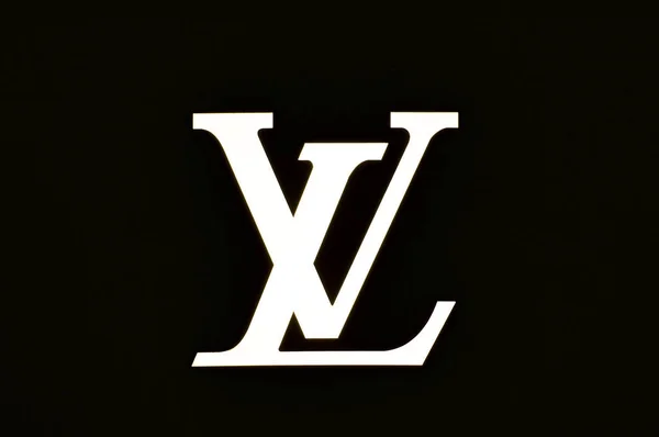 Illuminated Louis Vuitton brand logo — Stock Photo, Image