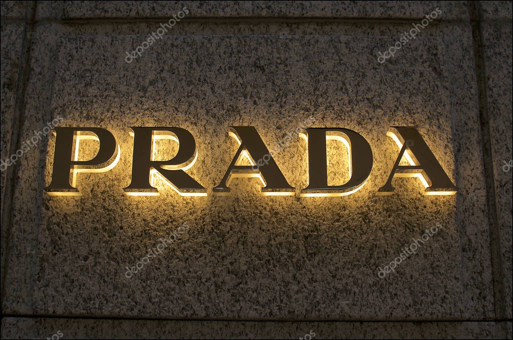 Lugano, Ticino, Switzerland - 17th August 2019 : Illuminated Prada logo installed at the wall of the store in Lugano city, Switzerland. Prada is a international italian luxury clothing company